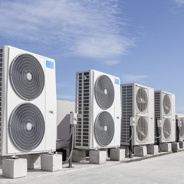 commercial HVAC units on the roof of a large industrial building